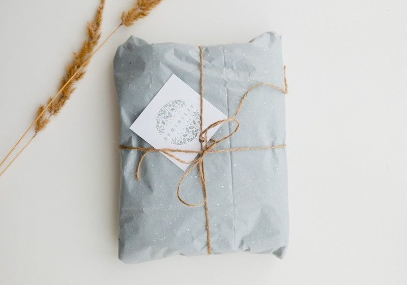 Gift wrapped in light blue wrapping paper for company gifts to employees