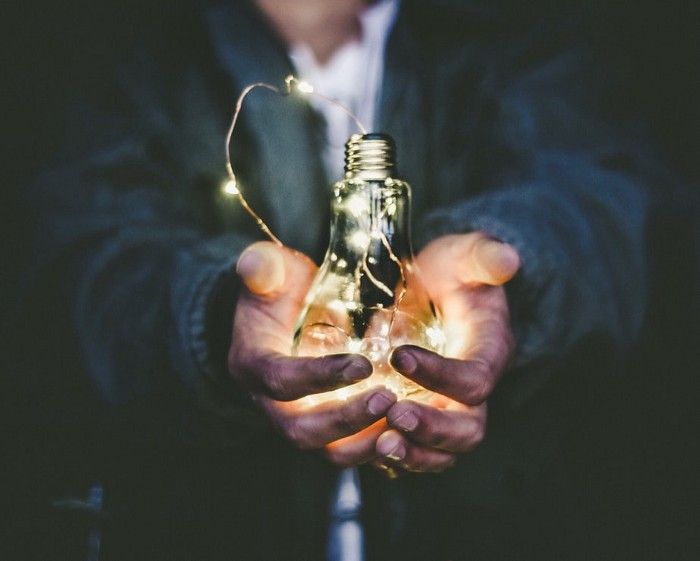 guy holding a bulb