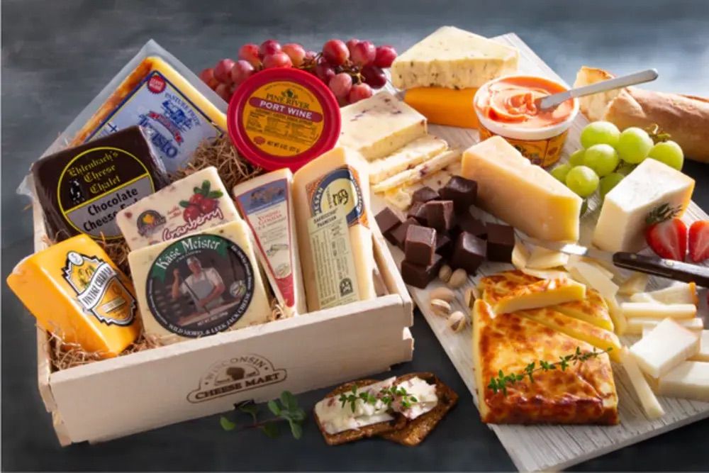 Assortment of Wisconsin cheeses in a wooden box.