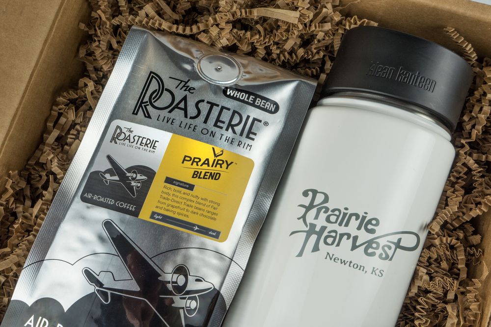 Coffee gift box containing a bag of Prairie Blend coffee beans and a Klean Kanteen thermos.