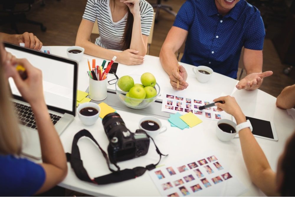 Graphic team designing employee wall of fame ideas