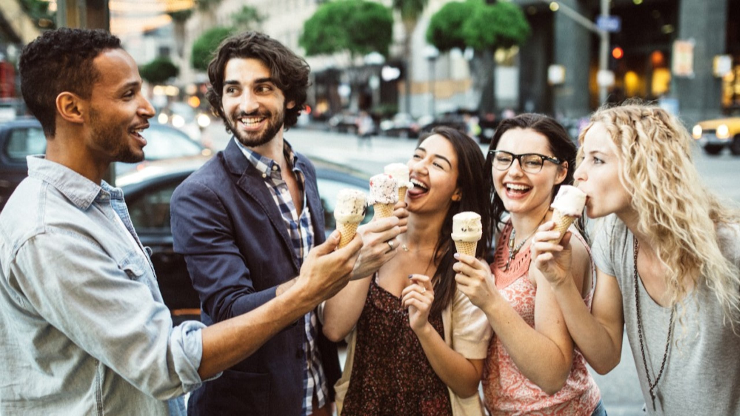 colleagues happily eating ice cream