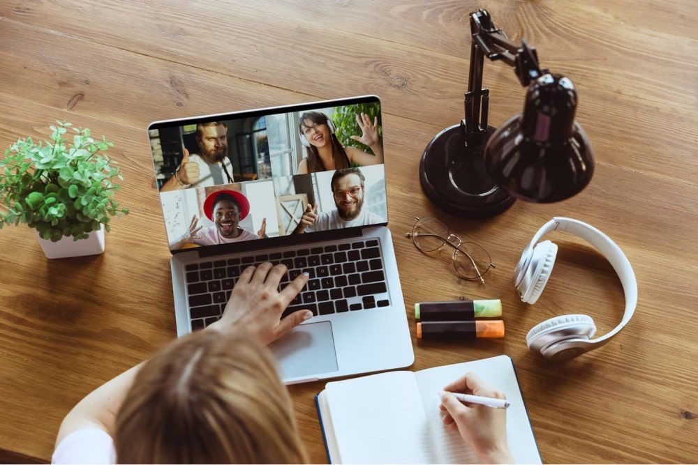 Photo of a remote meeting with a woman working from home