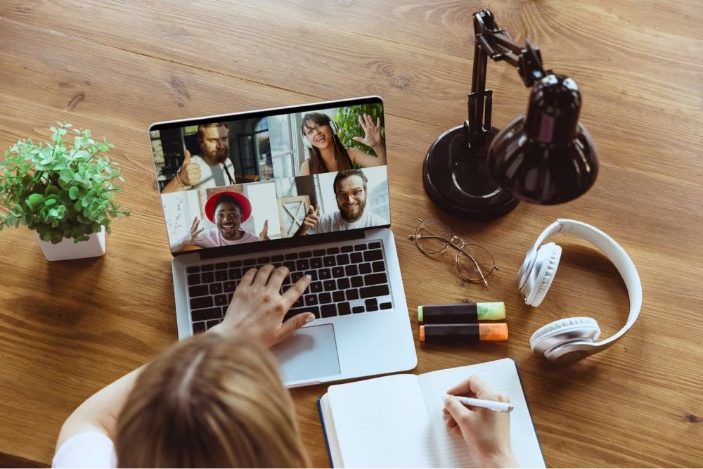 Photo of a remote meeting with a woman working from home to understand culture of recognition in the workplace