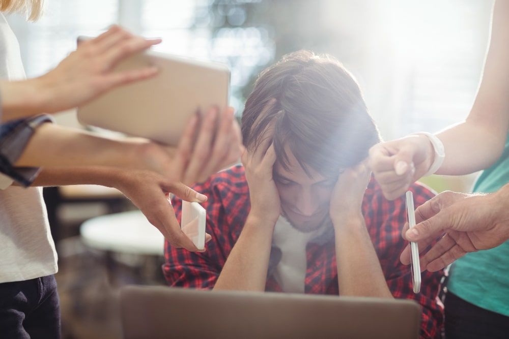 an exasperated business executive seated in a office environment