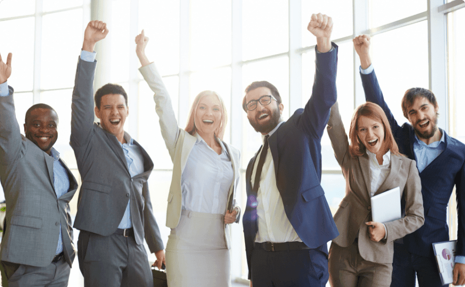 business people celebrating success after getting implementing employee rewards and recognition program examples