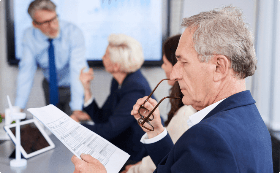 business person reading important documents on employee recognition program