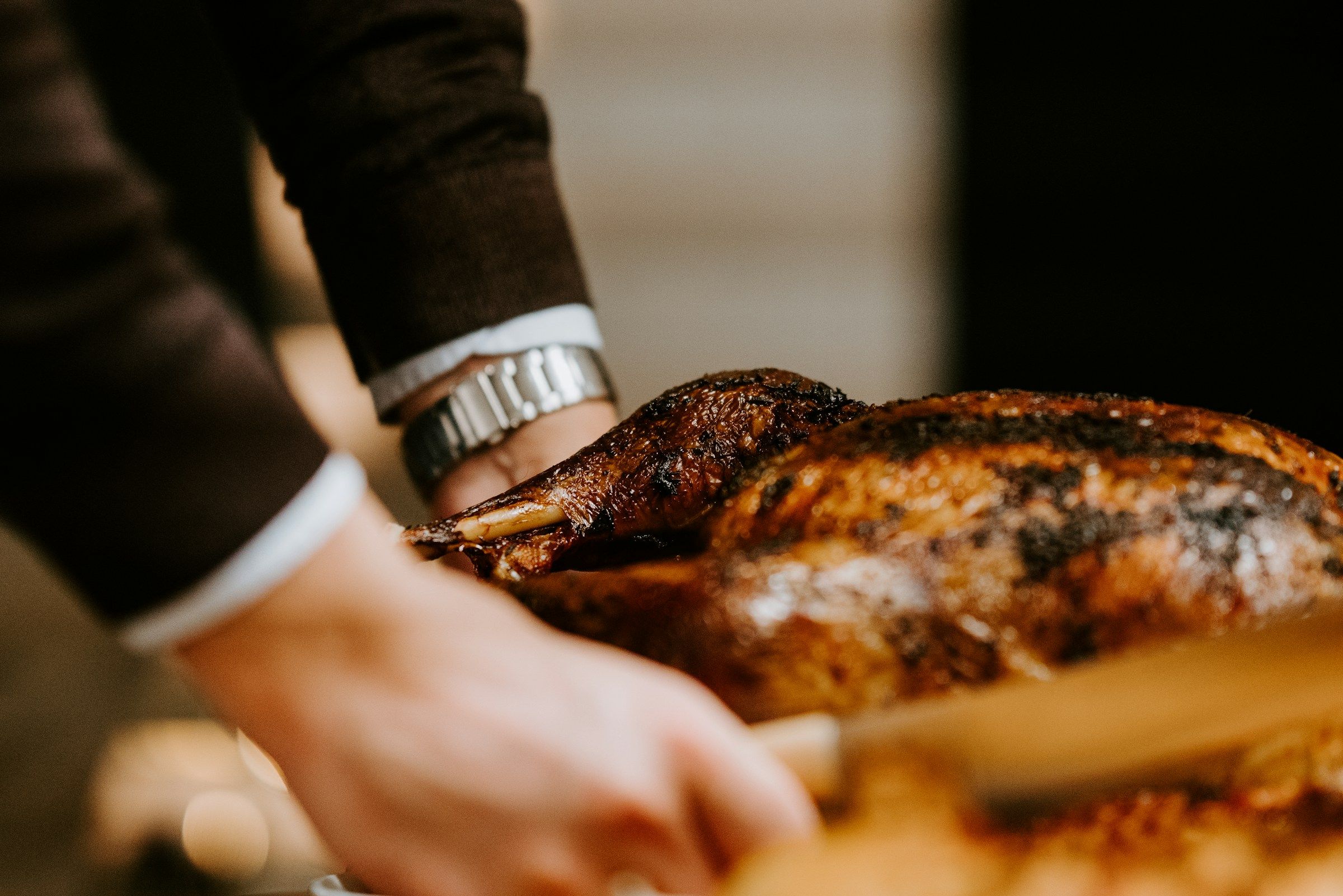 man serving roast turkey - Office Christmas Party Food Ideas