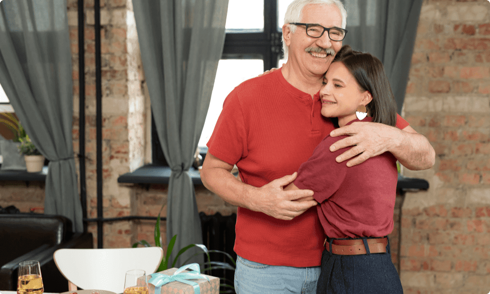 father hugging daughter both feeling happy seeing each other