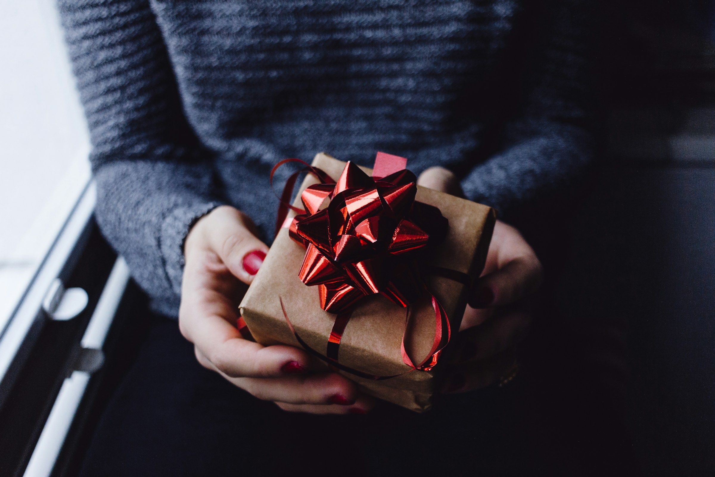 woman with a wrapped gift