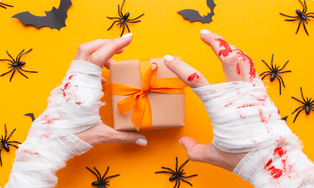 halloween gift box with bloody mummy hands