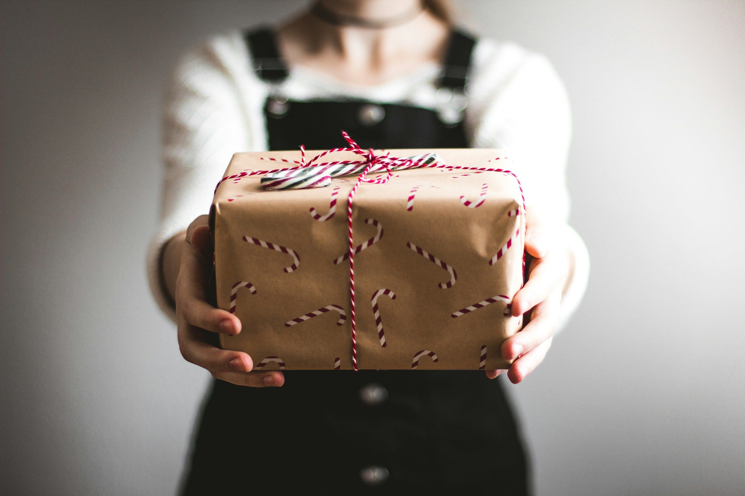 person giving gifts - Best Promotional Products