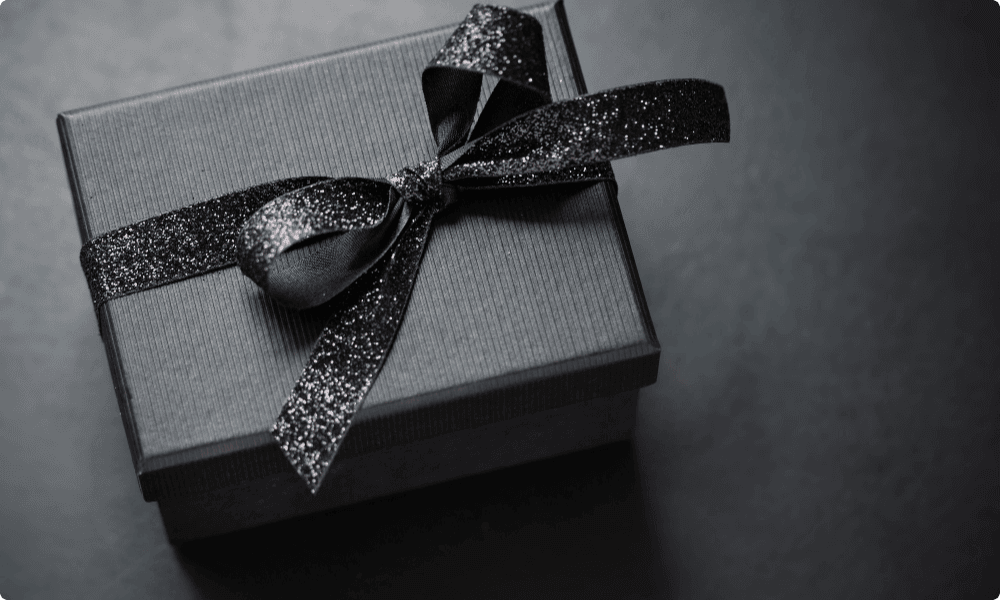 luxury client gifts in dark black giftbox with ribbon