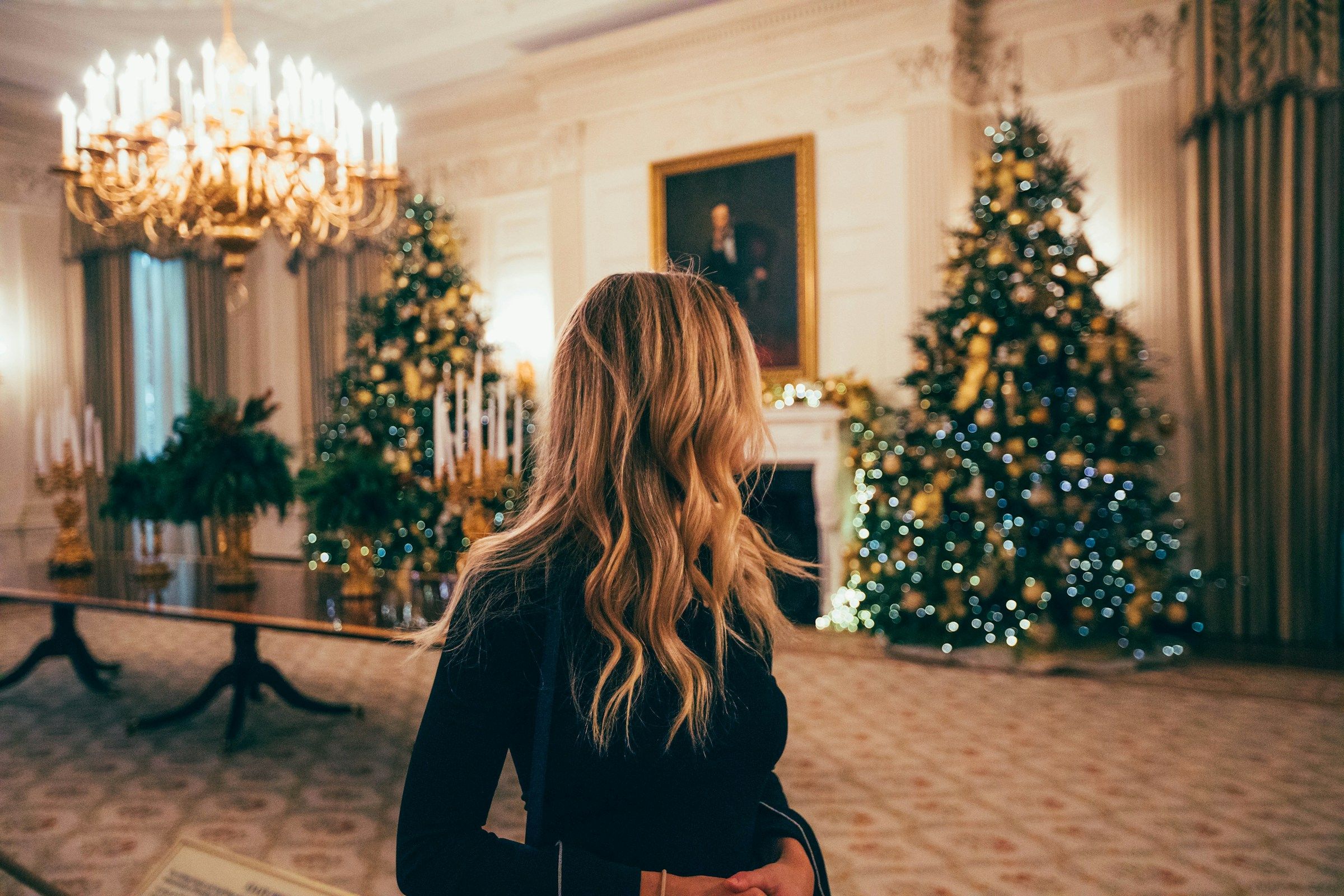 woman arriving at a party - Christmas Theme Ideas For Work