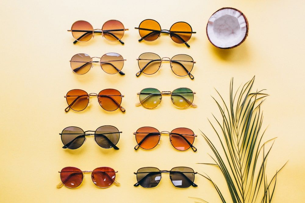set sunglasses yellow background isolated
