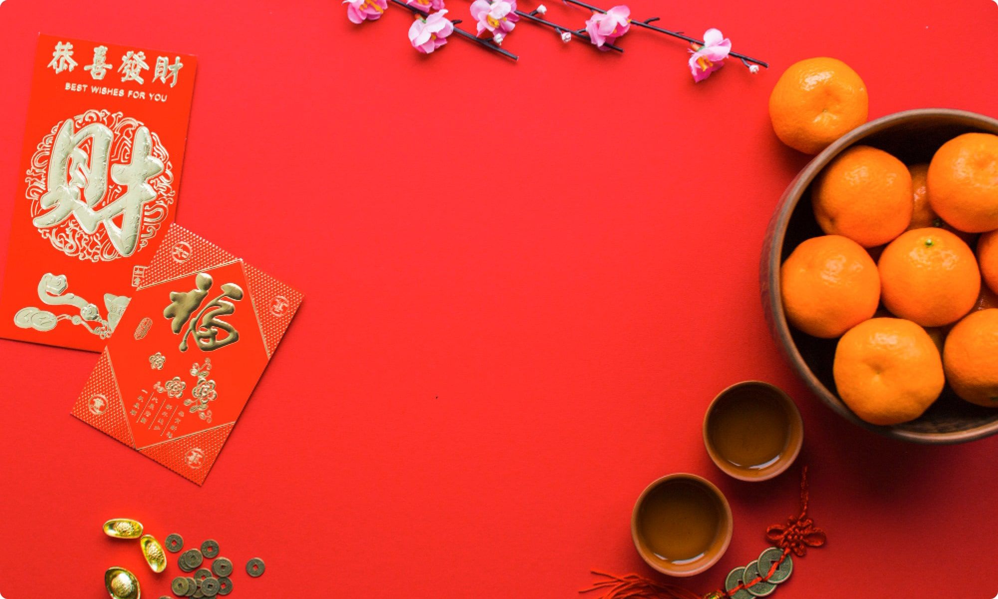 tangerines tea cups and red envelope for chinese new year