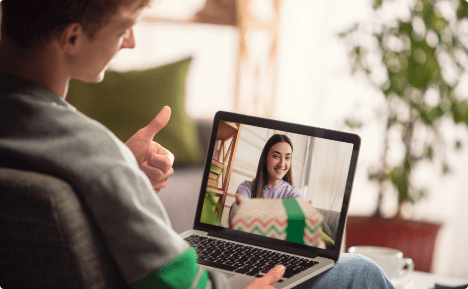 woman receiving her gifts for remote employees and opening remotely