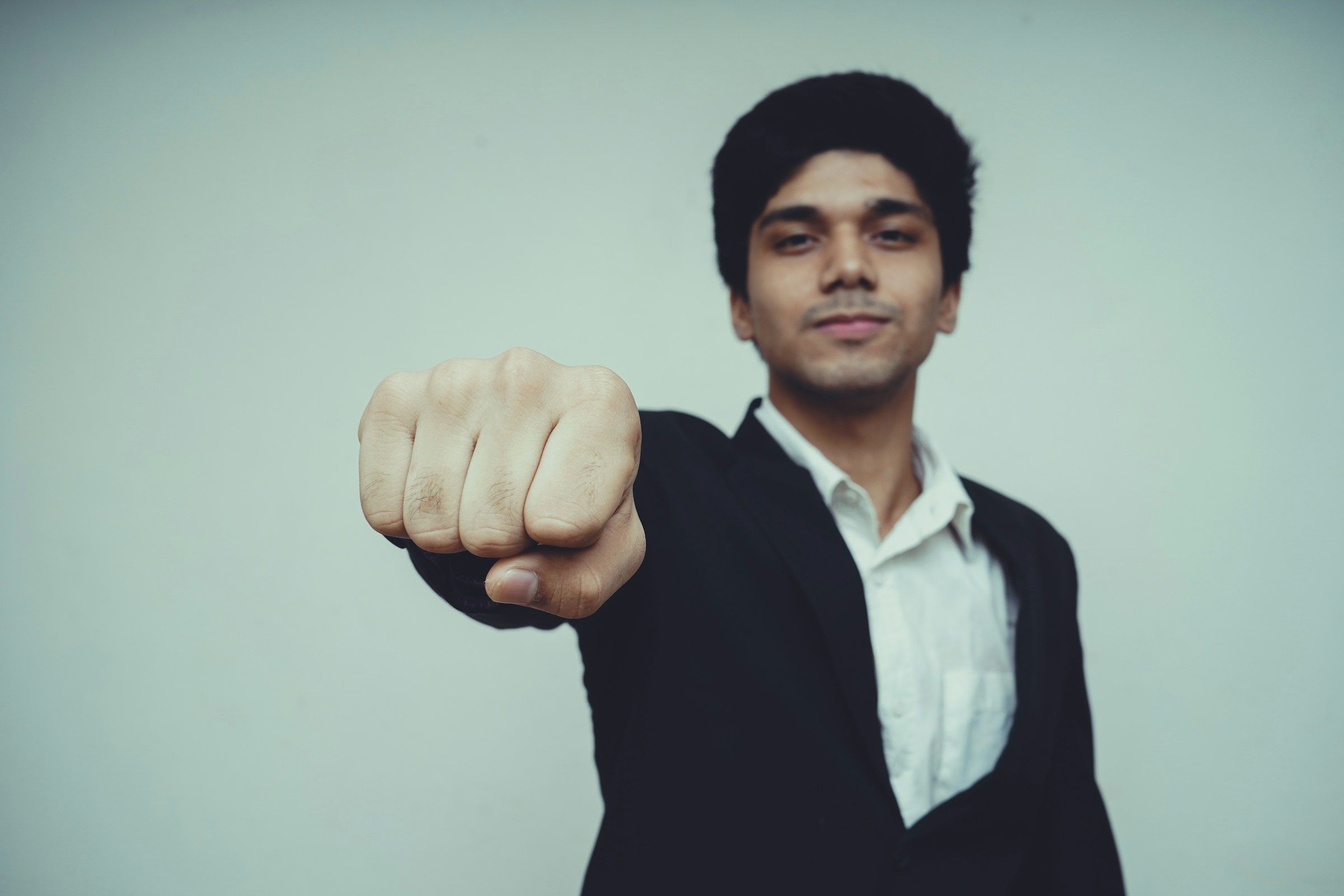 man giving a fist bump - Best Career Fair Swag 